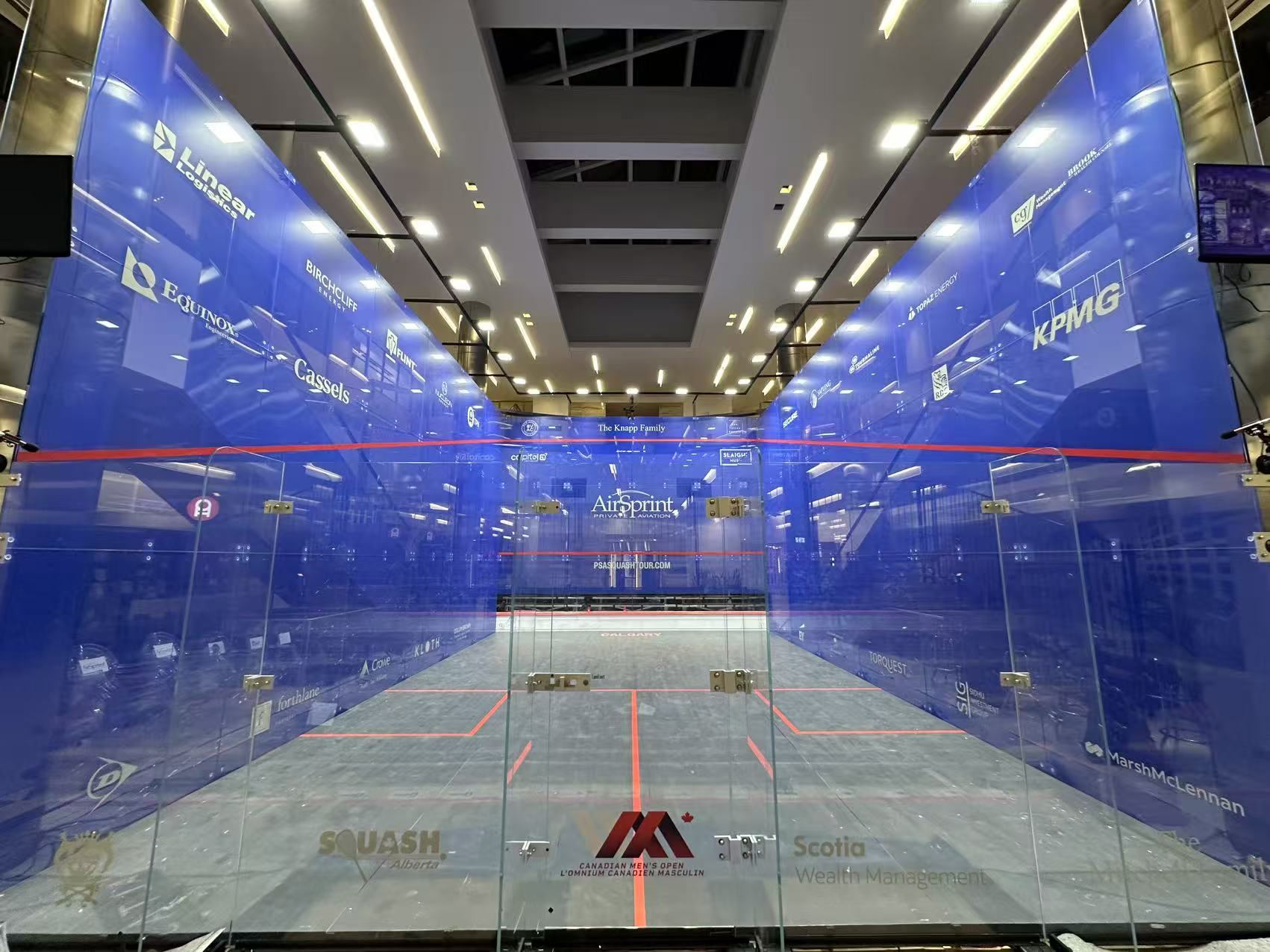 Spectators’ view into a branded glass court
