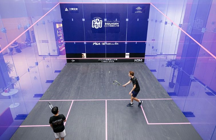 China Squash Open branded front wall during play
